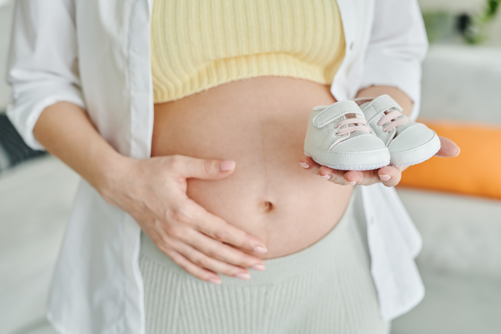 A doctor examining a baby Description automatically generated with low confidence