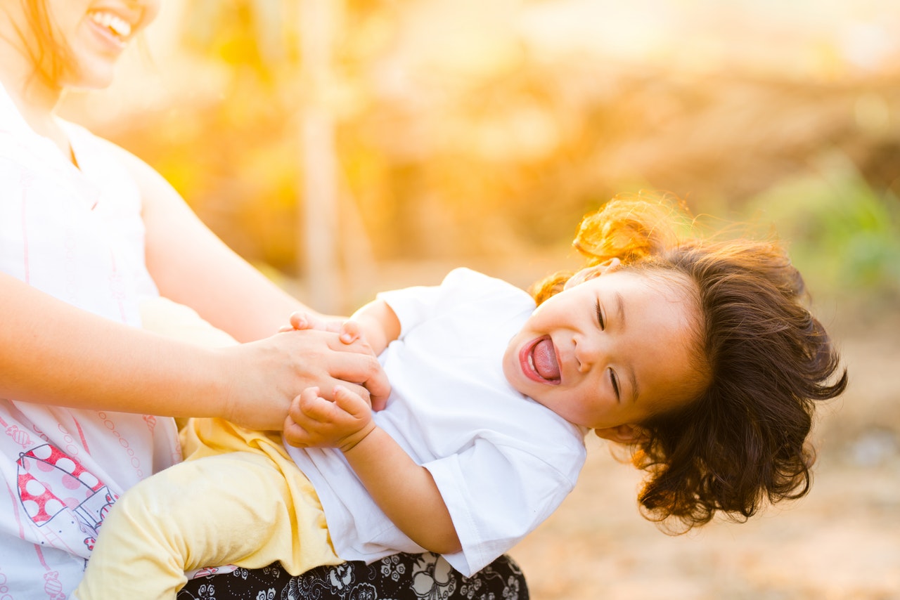 Singapore family benefits: Featuring mom and her child smile